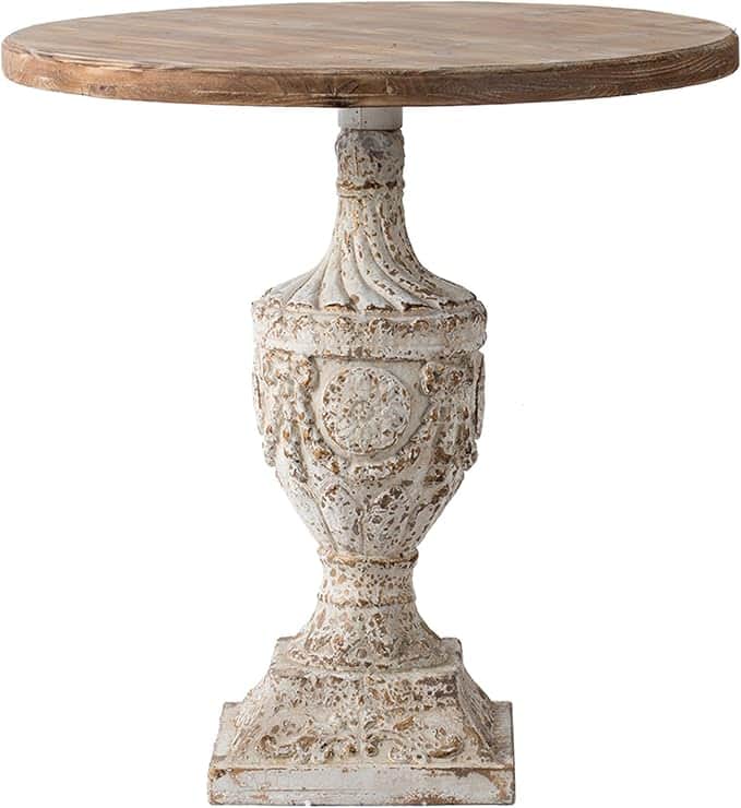 A rustic-style accent table featuring a round, light wood planked top and a highly ornate, distresse… — 3D model