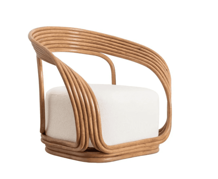 This is a contemporary armchair featuring a distinctive frame crafted from multiple curved rattan ro… — free OBJ 3D model