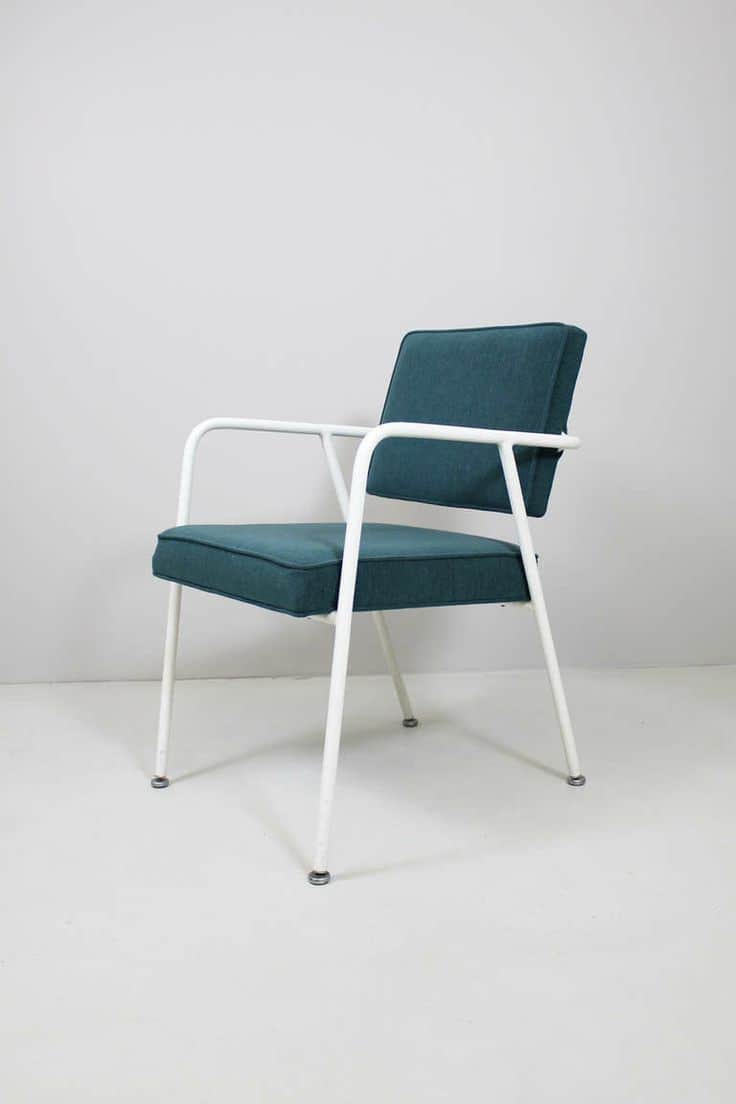 A mid-century modern armchair with a white tubular metal frame and upholstered seat and backrest in… — 3D model