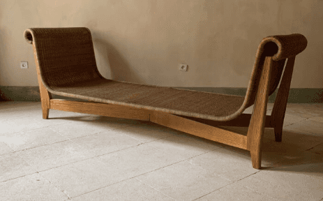 A contemporary chaise lounge with a sinuous, ergonomic design. The frame is constructed from light-c… — 3D model