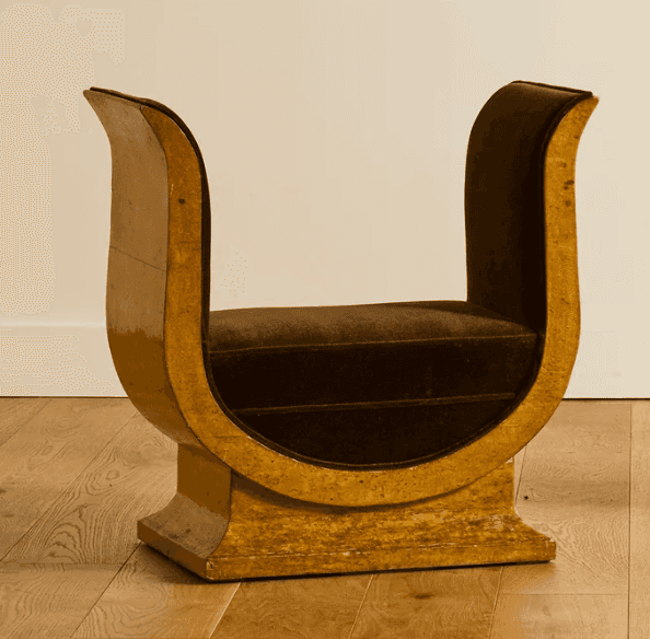 A distinctive bench with a U-shaped frame supporting a cushioned seat. The frame has a glossy, textu… — free SKP 3D model
