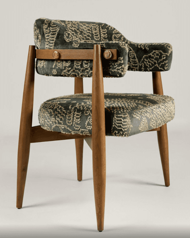 A stylish Mid-Century Modern armchair featuring a solid wood frame with tapered legs and dark green… — 3D model