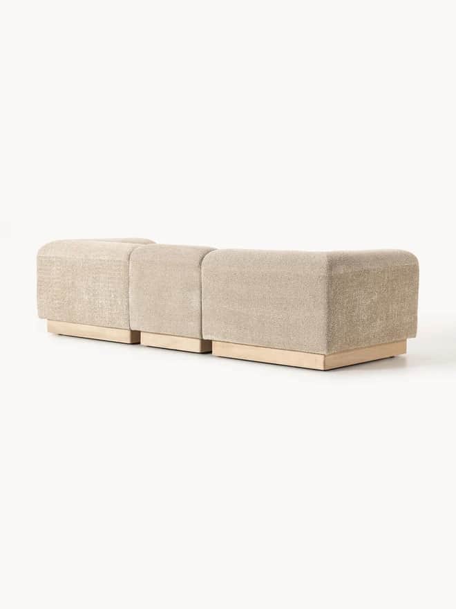 A modular upholstered bench consisting of three individual, backless sections. Each section is cover… — 3D model