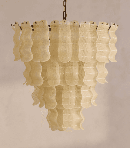 A multi-tiered chandelier with decorative elements resembling wavy glass or plastic strips. The stru… — 3D model