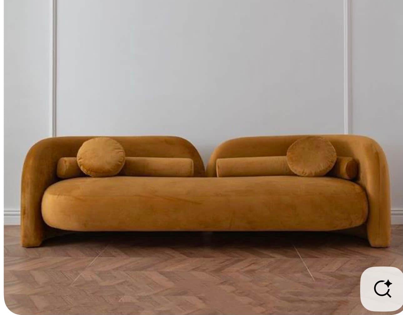 A long, curved, asymmetrical upholstered seating unit in golden-yellow velvet, featuring an integrat… — 3D model