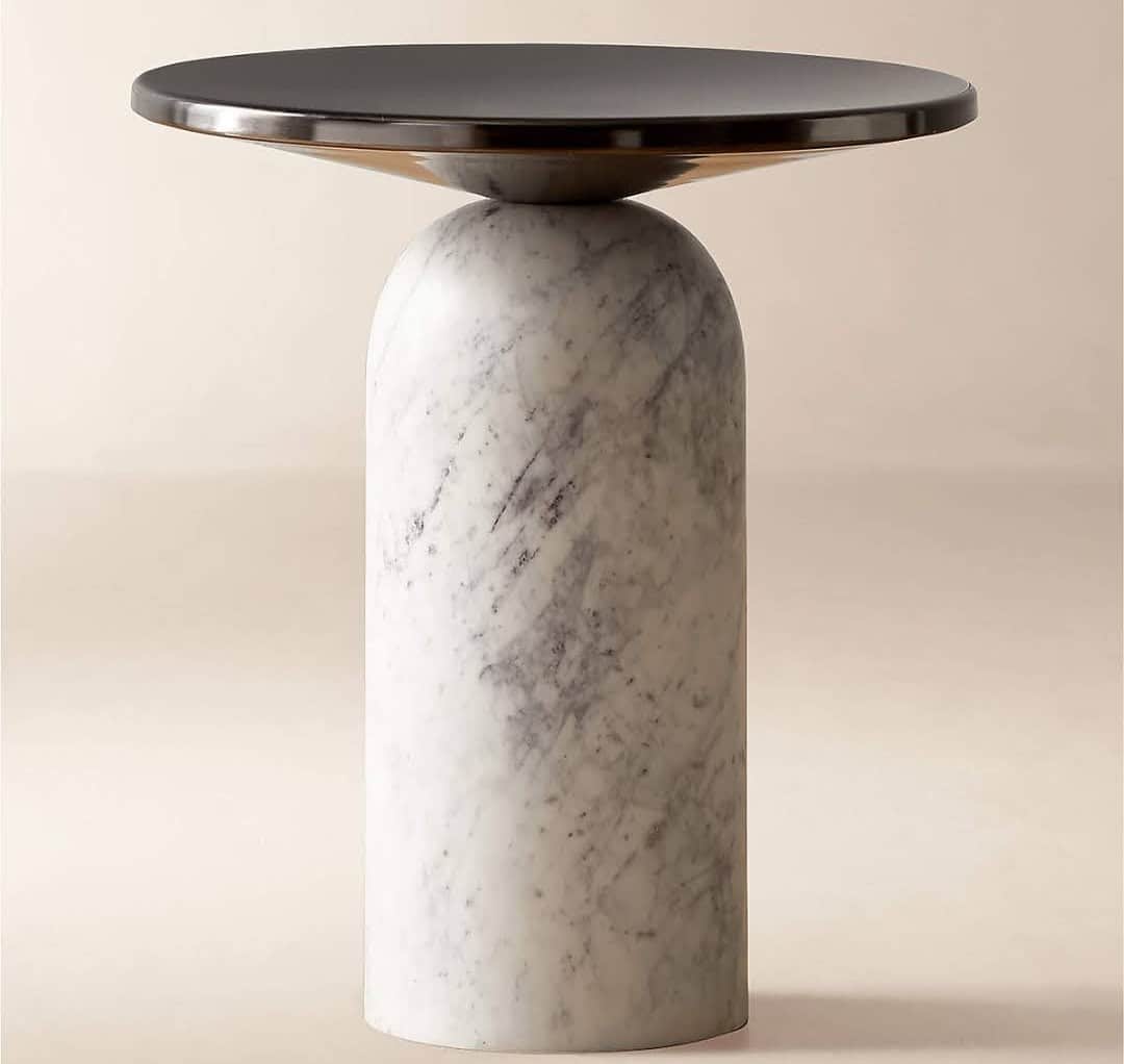 A modern accent table featuring a solid, cylindrical white marble base with grey veining, topped by… — 3D model