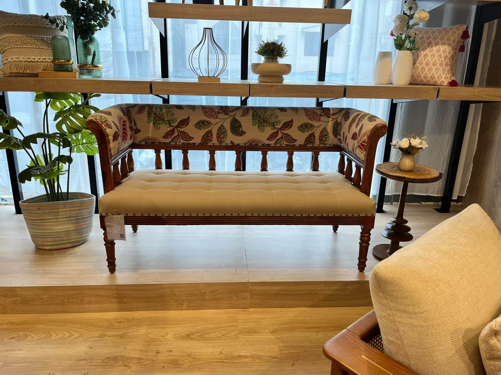 A traditional-style upholstered settee or bench featuring a dark wooden frame, a tufted cream-colore… — 3D model