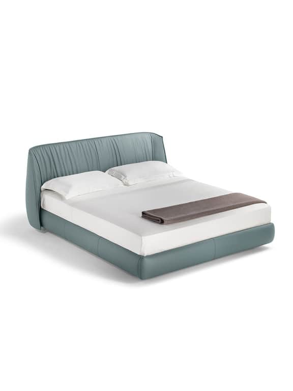 A contemporary upholstered platform bed featuring a high, slightly curved headboard with vertical ru… — 3D model