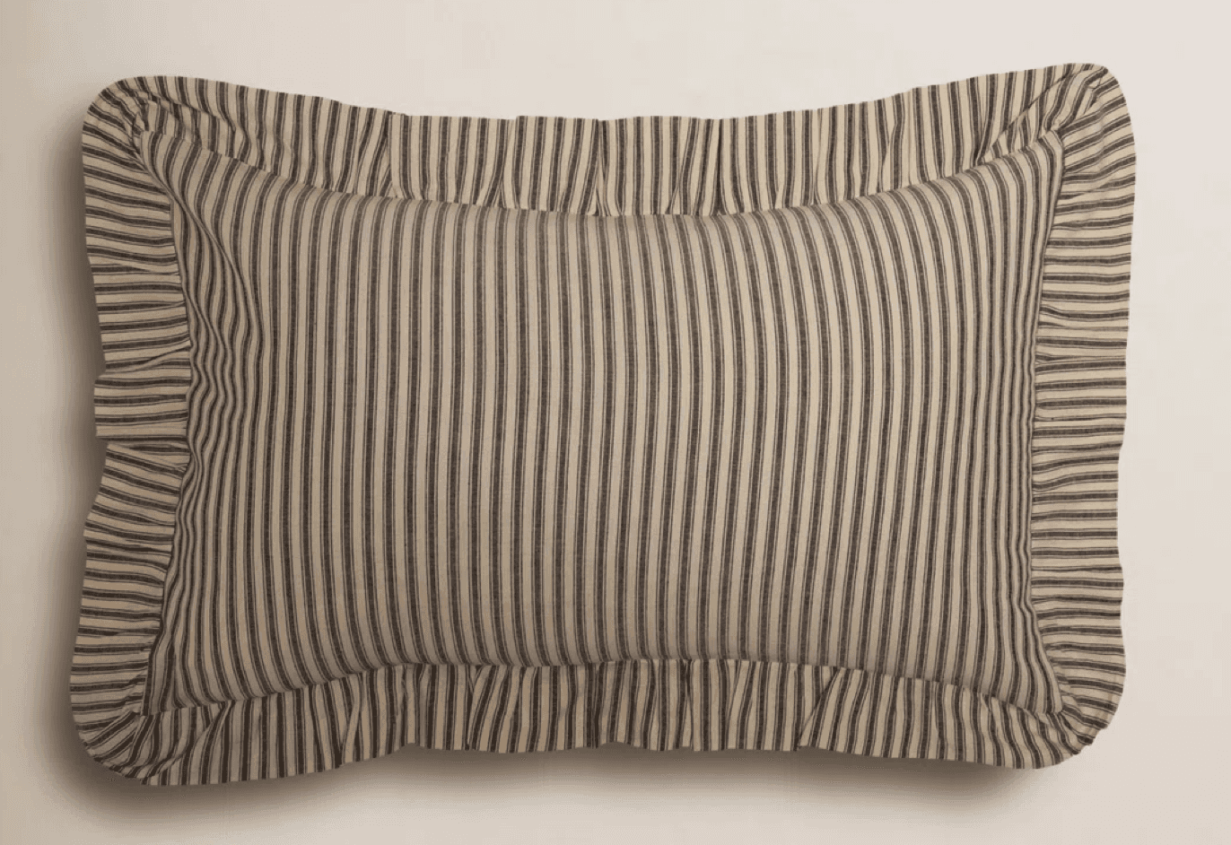 A rectangular pillow with a ticking stripe pattern, featuring a ruffled flange along all edges. The… — 3D model