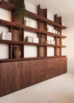 A large, wall-mounted shelving unit with a base cabinet. The shelving unit features multiple horizon… — 3D model