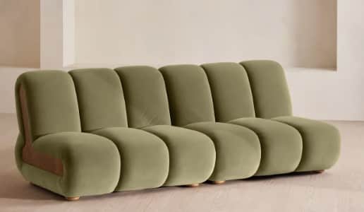 A contemporary sofa featuring a plush, olive-green upholstered finish composed of multiple rounded,… — 3D model