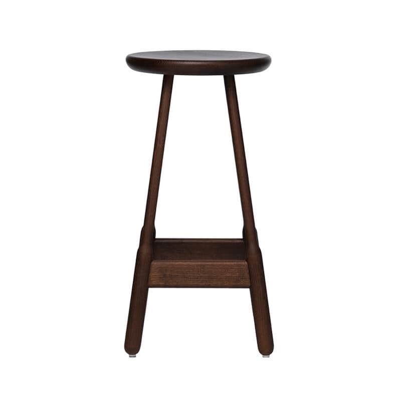 A dark wood stool with a circular seat and four tapered legs connected by a lower shelf. The legs ar… — 3D model