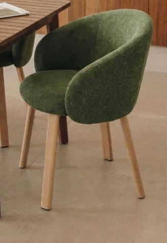 A contemporary dining armchair featuring a dark green, textured upholstered seat and back, with inte… — 3D model