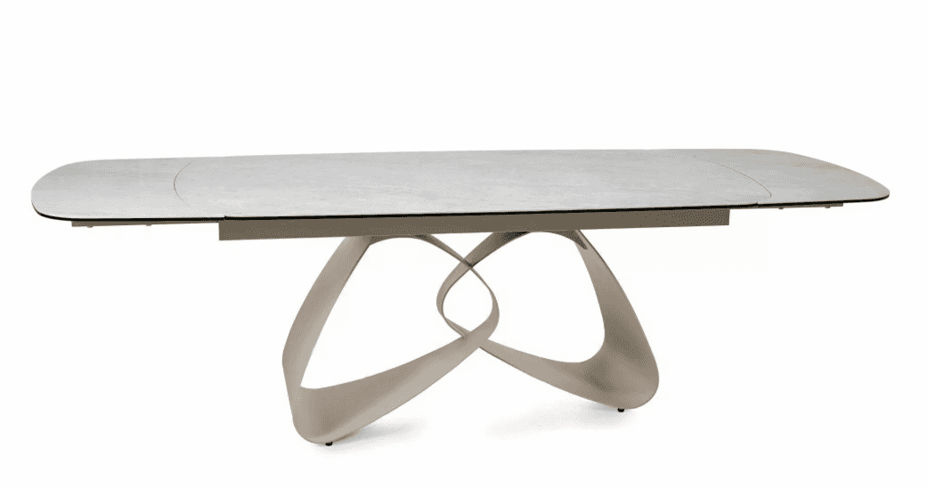 A modern dining table with a rectangular, elongated tabletop featuring softly rounded corners. The t… — 3D model