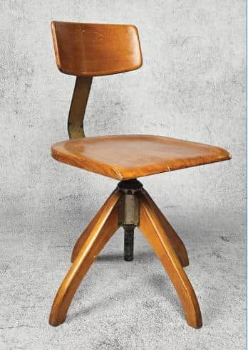 A contemporary or retro-inspired industrial swivel desk chair featuring a curved, bentwood seat and… — 3D model