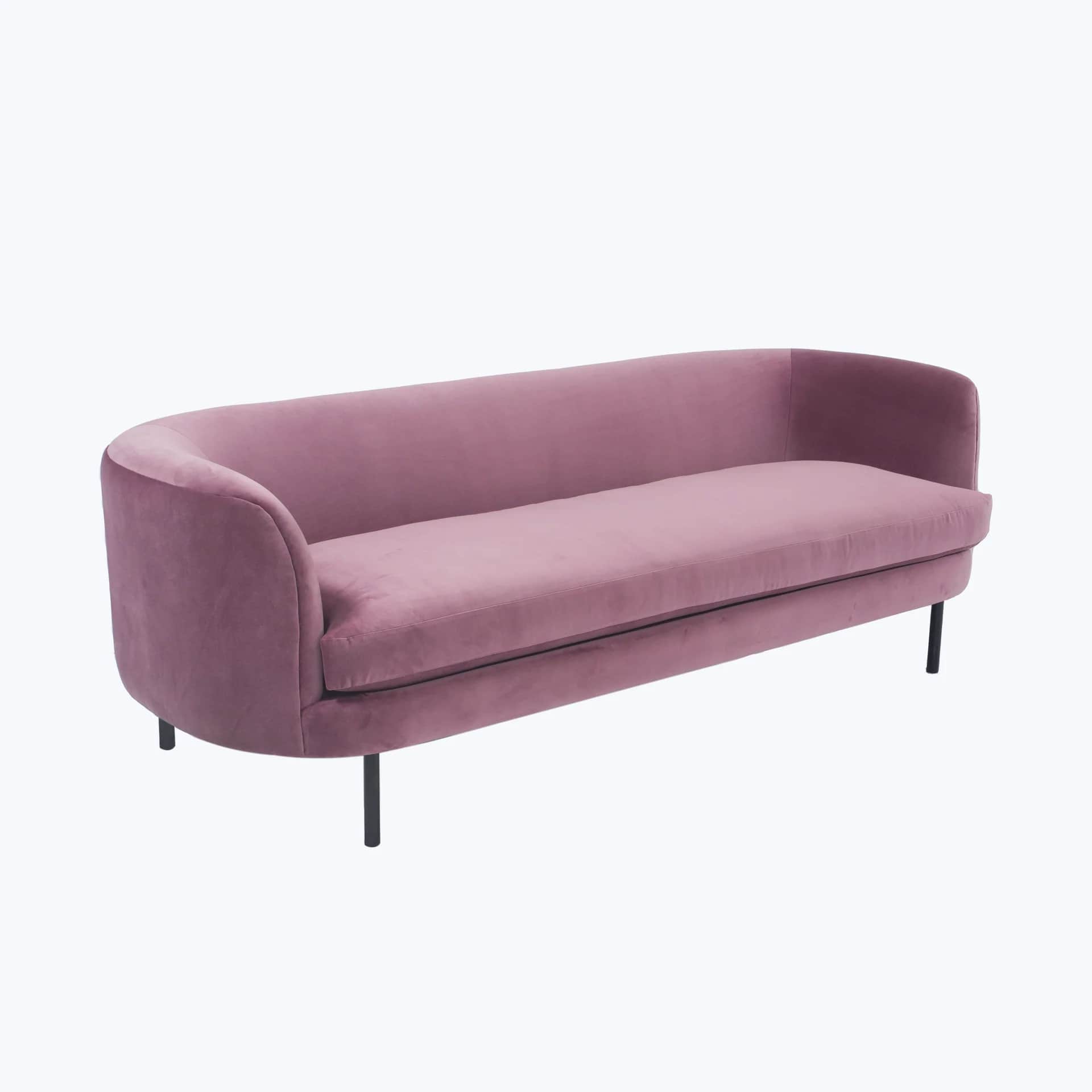 A pink velvet sofa with a curved back and arms, featuring a single seat cushion and a slender black… — free GLTF 3D model