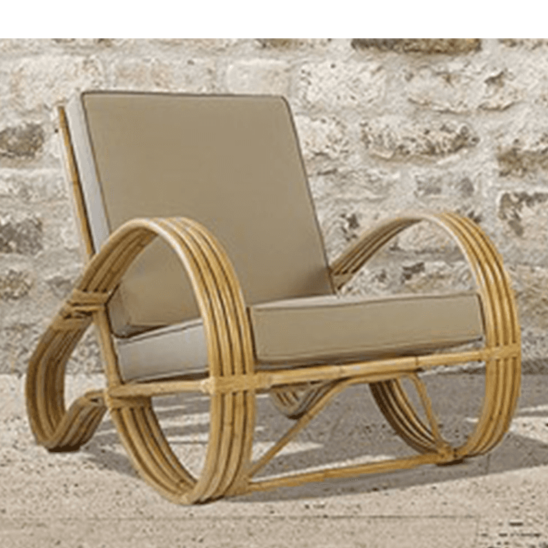 A rattan armchair with curved armrests and circular base supports. The chair features thick cushions… — free OBJ 3D model