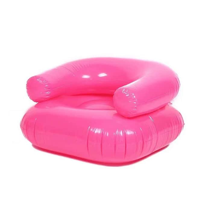 A vibrant hot pink inflatable lounge chair, designed for casual seating. It features a low-slung, ci… — 3D model