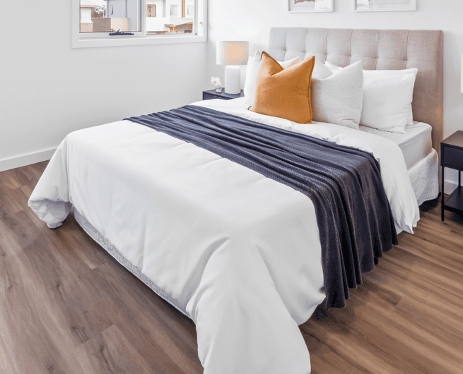 A modern upholstered platform bed featuring a channel-tufted headboard, presented with neutral-toned… — 3D model