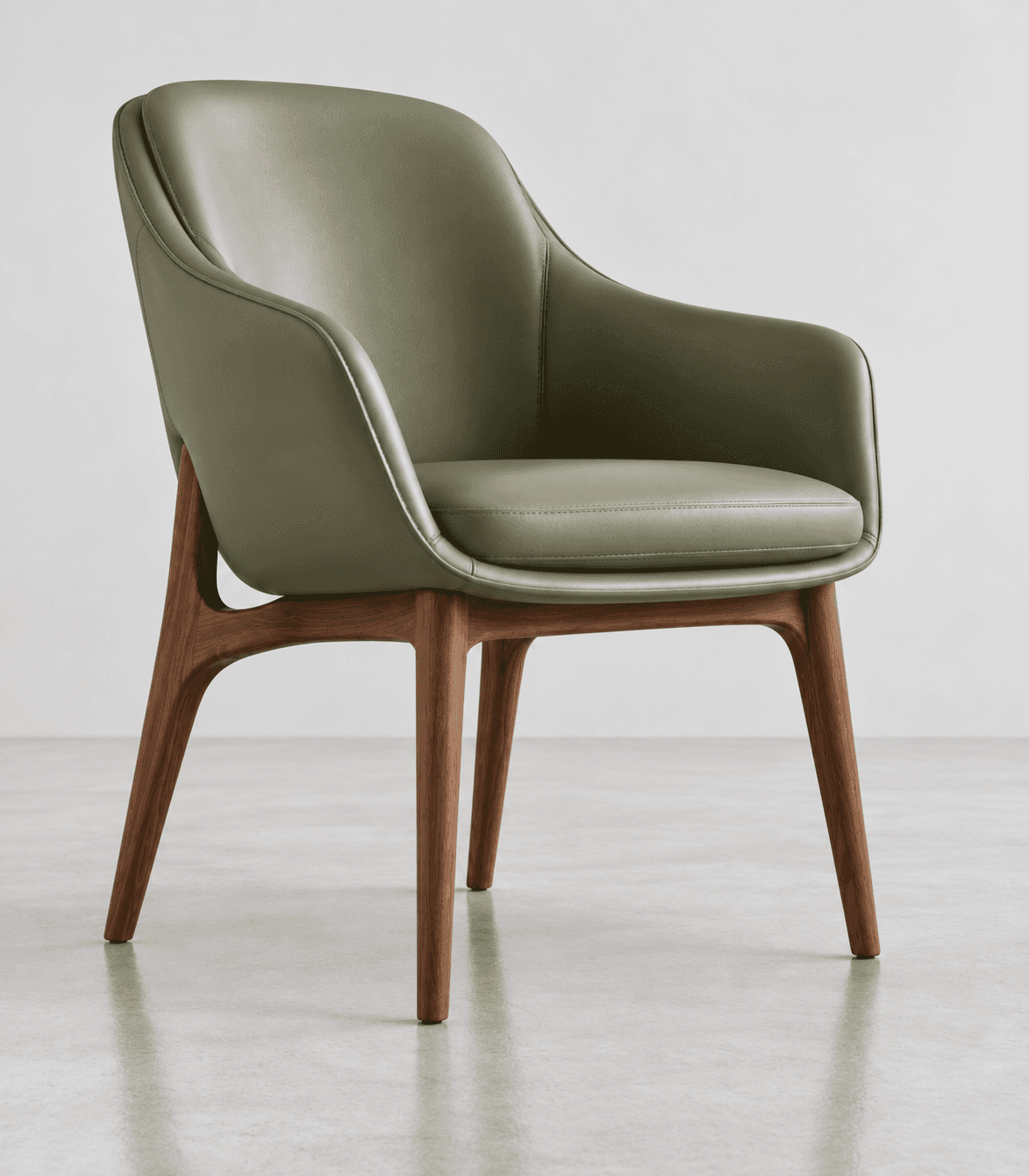 A contemporary armchair featuring a curved, enveloping shell upholstered in a sage green material, l… — 3D model