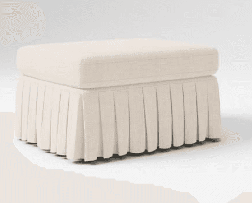 A rectangular upholstered ottoman featuring a padded top cushion and a pleated fabric skirt that con… — 3D model