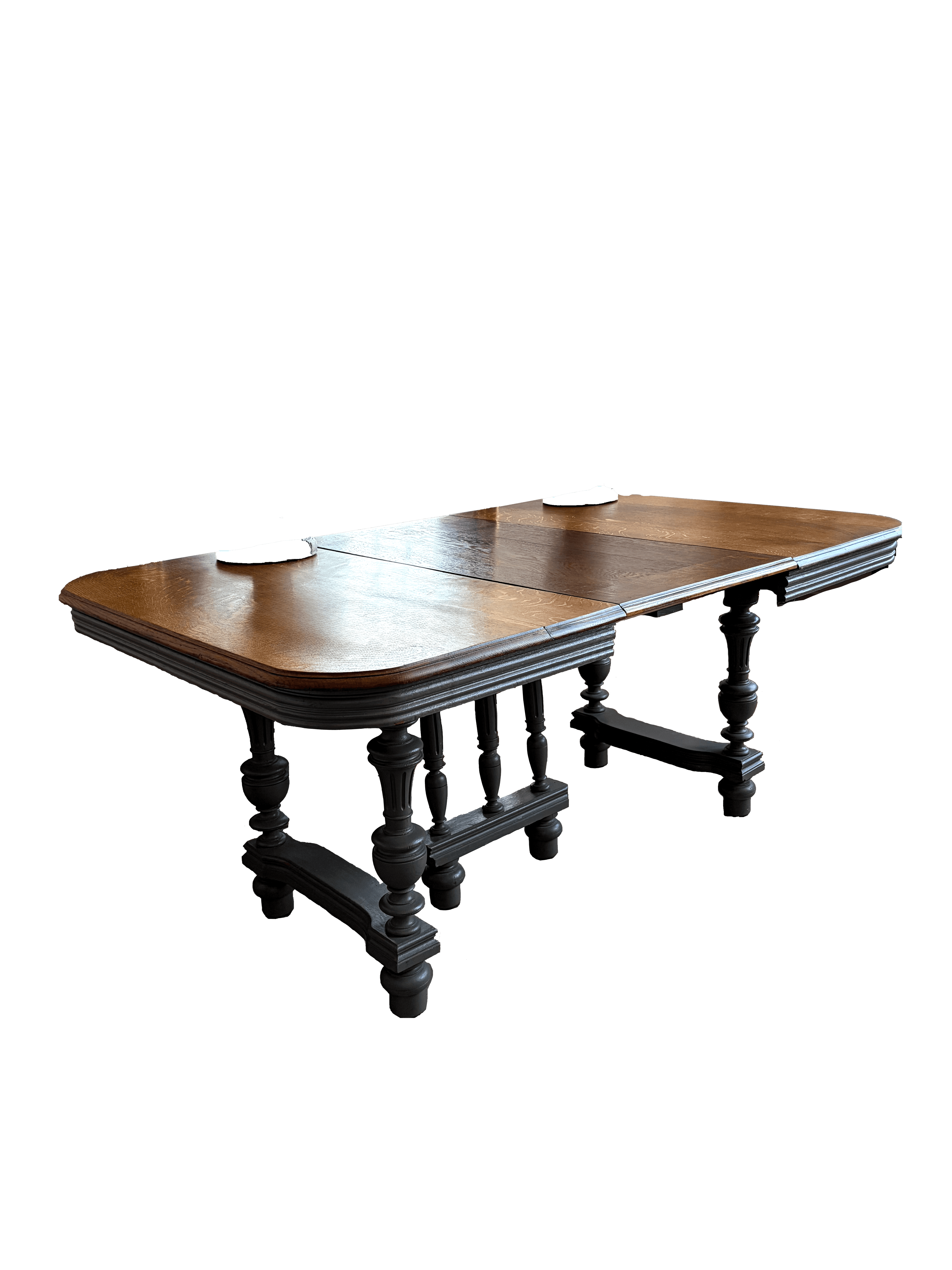 A traditional extendable dining table featuring a polished dark oak tabletop with rounded corners an… — 3D model