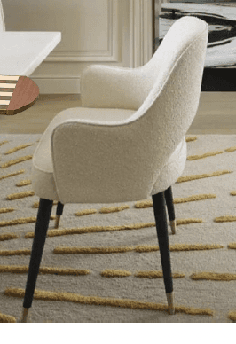 A modern upholstered armchair featuring a curved backrest with a cut-out detail, and an upholstered… — 3D model