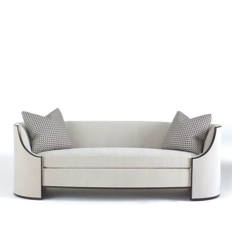 A contemporary sofa featuring a curved silhouette, upholstered in a light-colored fabric, with disti… — 3D model