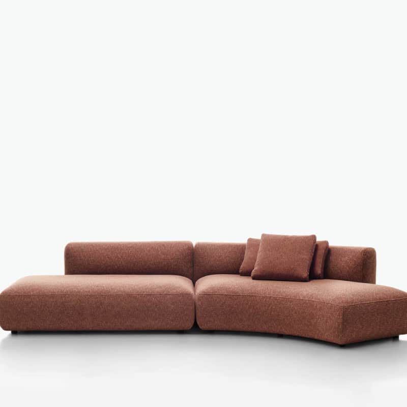 A modular sectional sofa with a low profile and rounded edges. The sofa appears to be upholstered in… — free OBJ 3D model