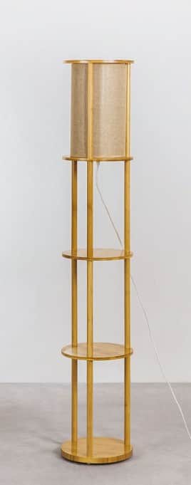 A tall, modern floor lamp featuring a light-toned wooden frame and a cylindrical fabric lampshade. T… — 3D model