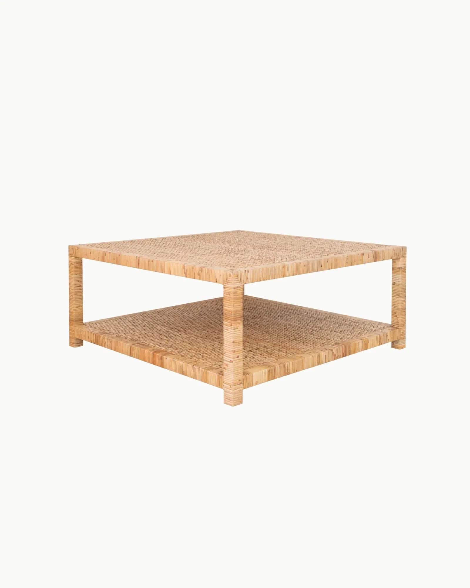 A square, two-tiered coffee table crafted entirely from woven rattan, featuring a natural light brow… — 3D model