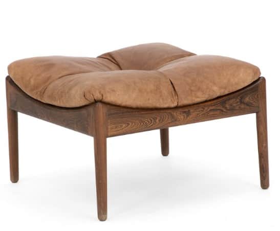 A Mid-Century Modern ottoman featuring a dark-grained rosewood frame with elegantly curved rails and… — 3D model