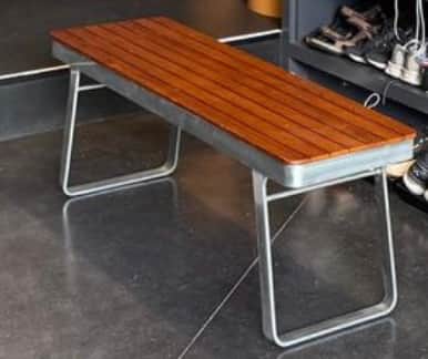 A modern bench featuring a rectangular seating surface composed of parallel wooden slats, supported… — 3D model