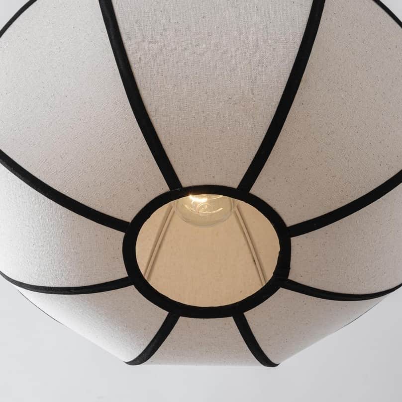 A close-up view of the underside of a fabric chandelier. The shade is constructed from light-colored… — 3D model