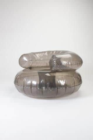 An armchair constructed from inflatable, translucent gray material. The design features a rounded, s… — 3D model