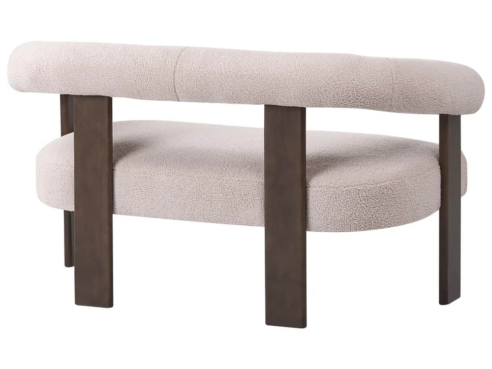 An armchair with a rounded, upholstered backrest and seat, supported by dark, rectangular metal legs… — 3D model