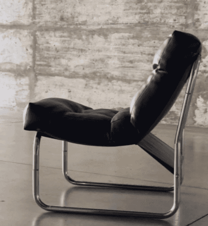 A modern lounge chair with a tufted seat and backrest, supported by a polished chrome tubular frame.… — free OBJ 3D model