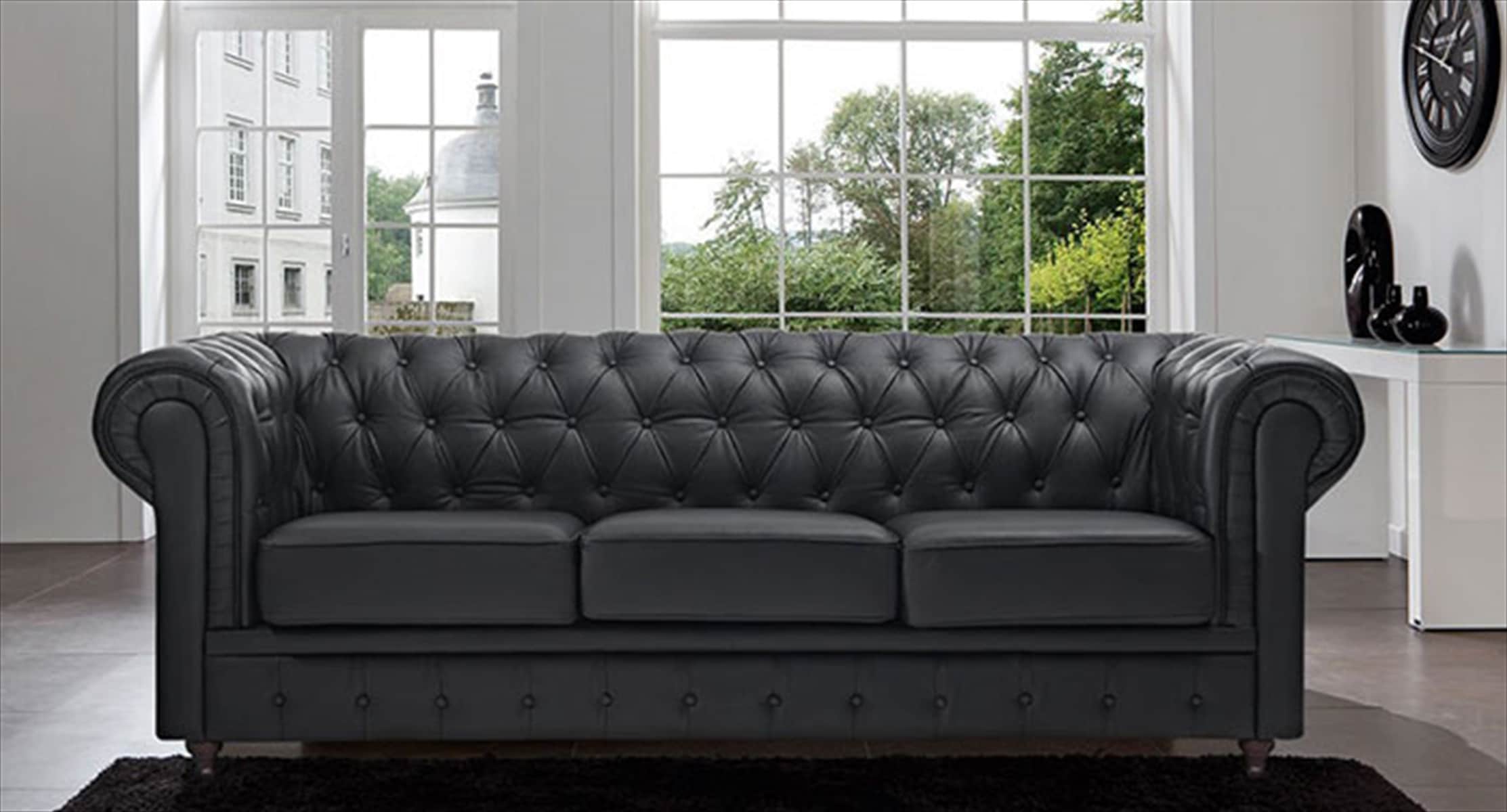 A classic three-seat Chesterfield sofa upholstered in black faux leather, featuring distinctive deep… — 3D model
