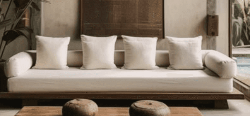 A modern, low-profile sofa featuring a dark wooden platform base and light cream-colored upholstery.… — free SKP 3D model
