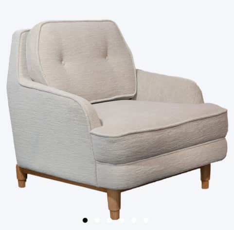 A upholstered armchair with a tufted back cushion. The armchair features a rounded silhouette with p… — free OBJ 3D model