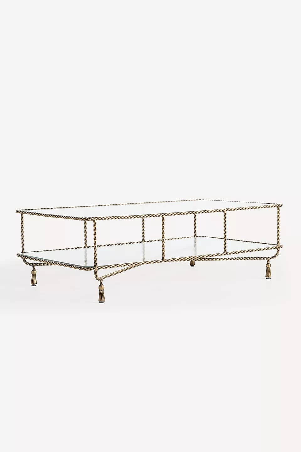 A long, rectangular coffee table with a metal frame and glass top. The frame is made of twisted meta… — 3D model