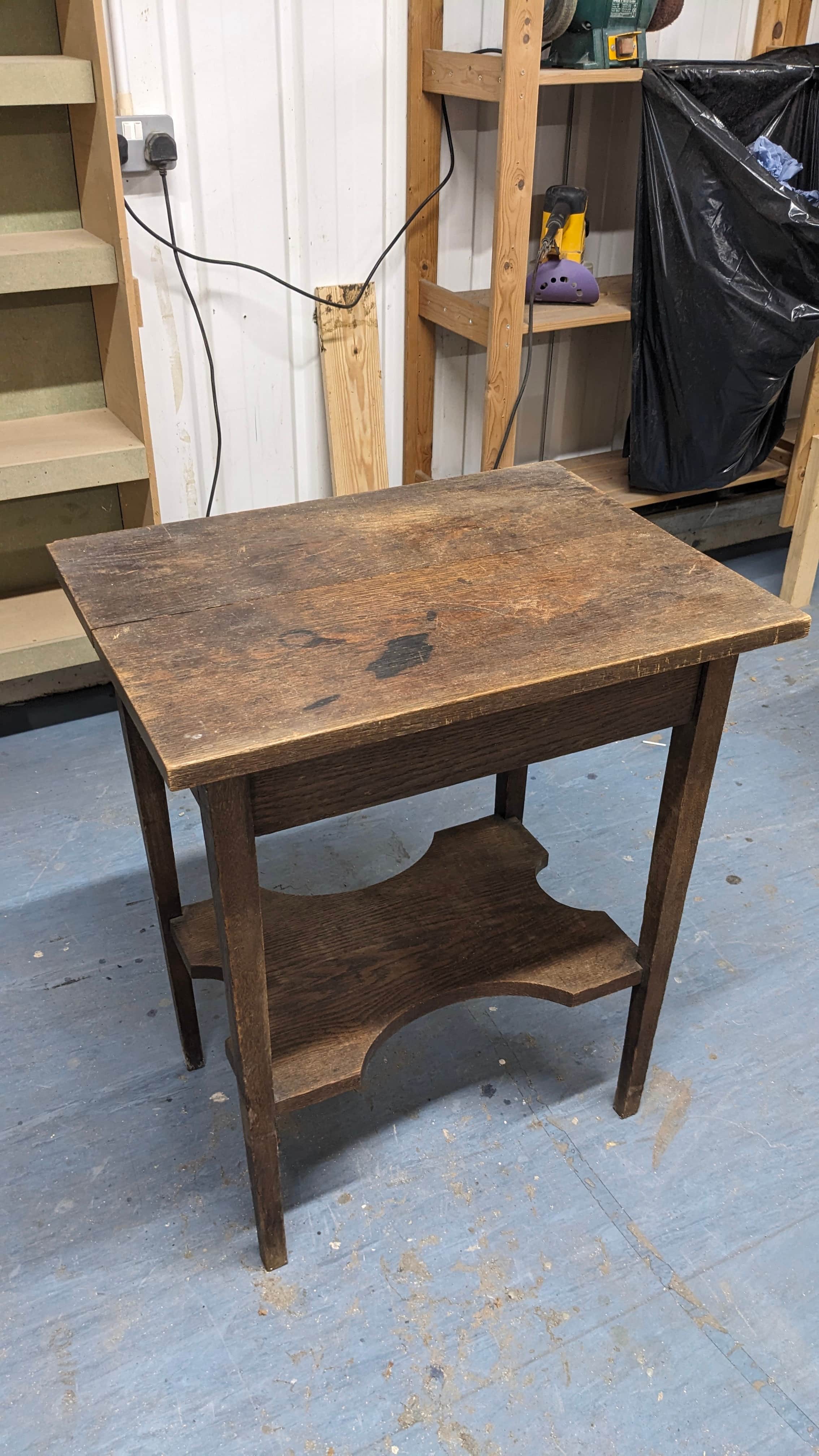 A rustic, rectangular wooden accent table with two tiers. The upper surface is a simple rectangular… — 3D model