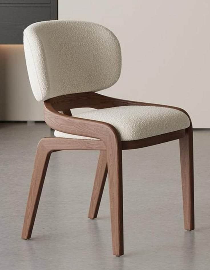 A modern dining chair featuring a gracefully curved wooden frame that elegantly supports both the up… — 3D model