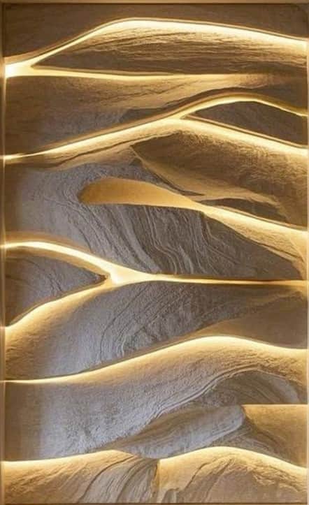 A decorative wall panel with a textured, layered design mimicking natural rock formations. Integrate… — 3D model