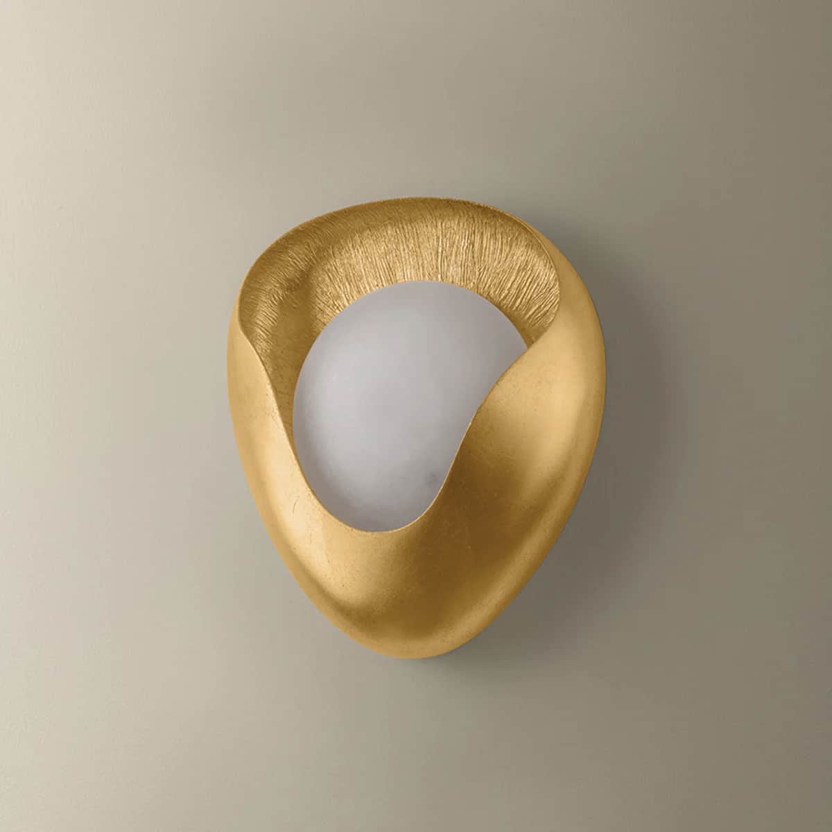 A modern, sculptural wall sconce featuring an abstract, organic shape with a textured gold finish, p… — free GLB 3D model