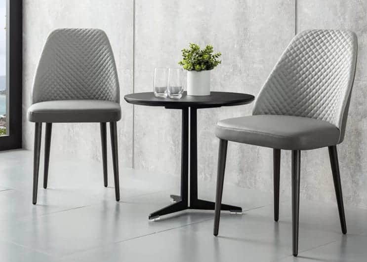 A modern black round side table with a minimalist design, featuring a circular top and a sturdy meta… — free STL 3D model