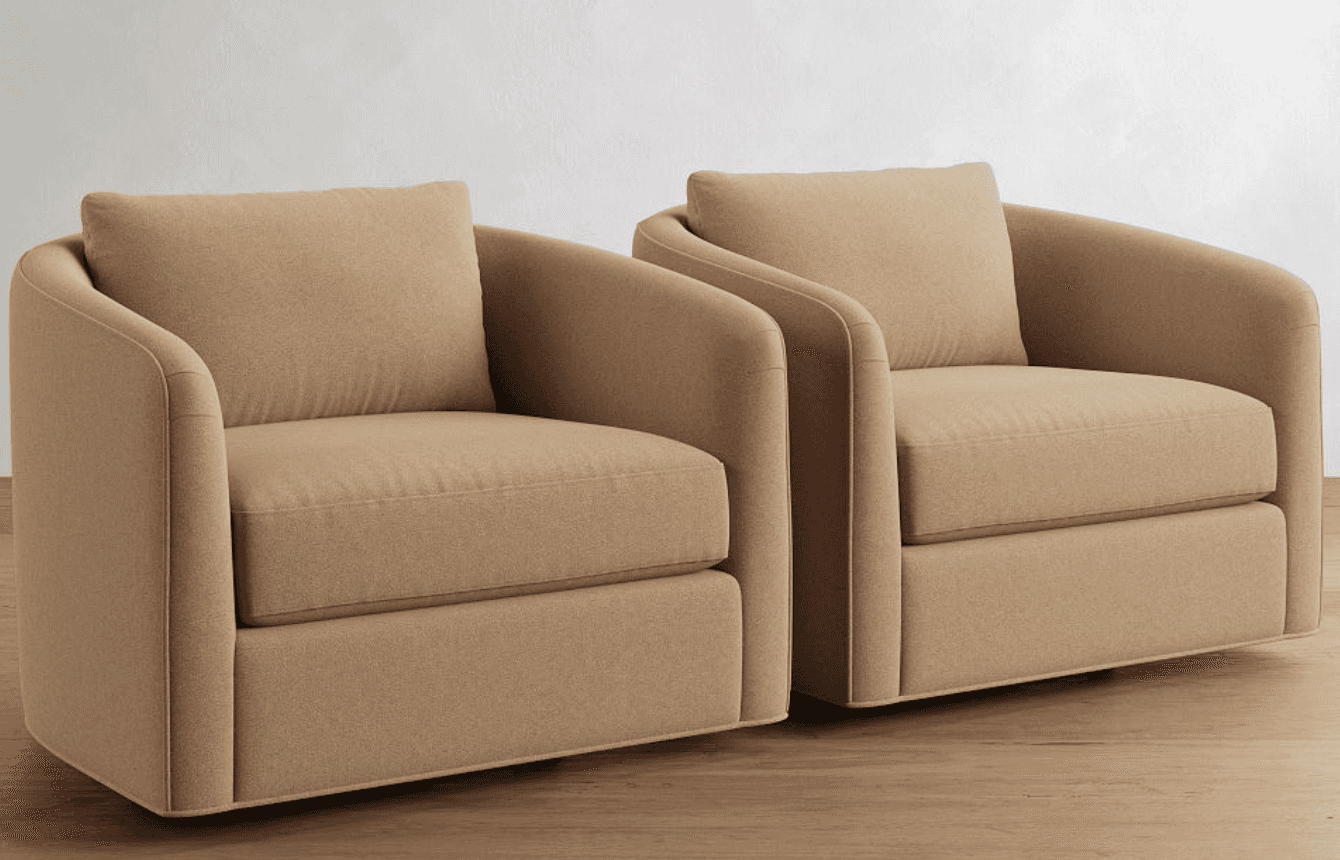 A pair of contemporary upholstered armchairs, each featuring a rounded silhouette with integrated ar… — 3D model