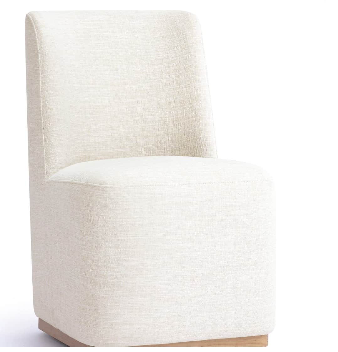 An armless, fully upholstered modern chair with a low back and a solid block-like base, featuring a… — 3D model
