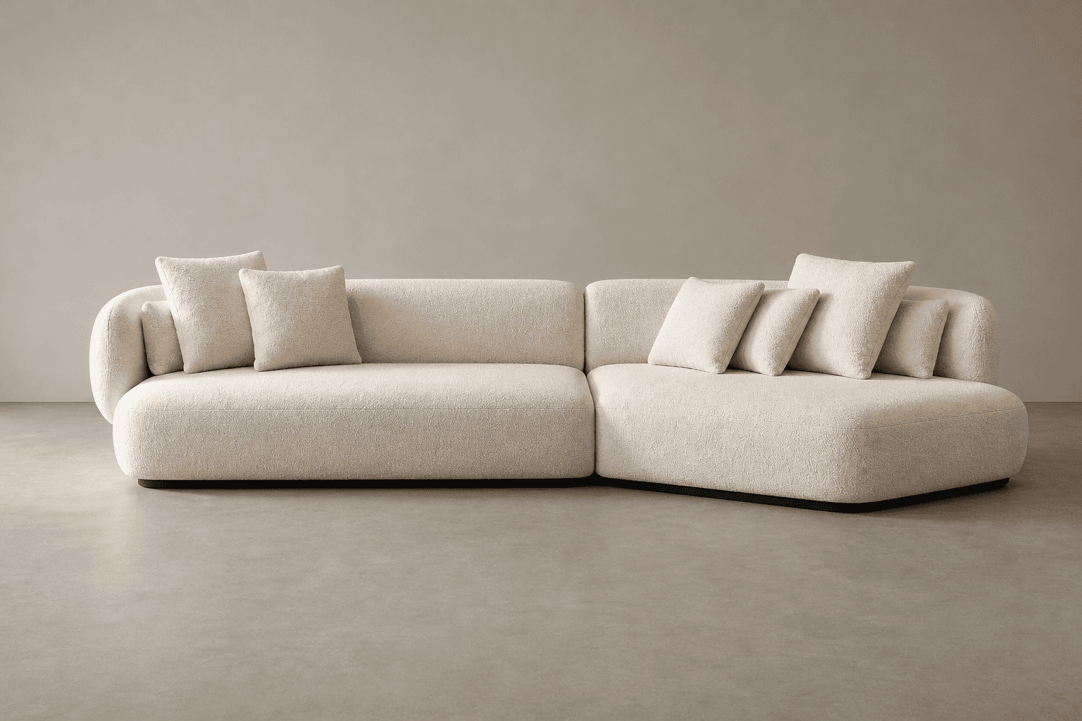 A sectional sofa with a low profile and rounded arms and back. The sofa is upholstered in a textured… — 3D model