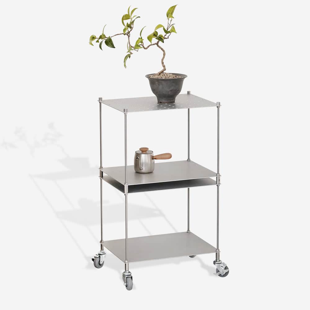 A three-tiered metal cart with casters. The top shelf features a perforated pattern. The cart is mad… — 3D model